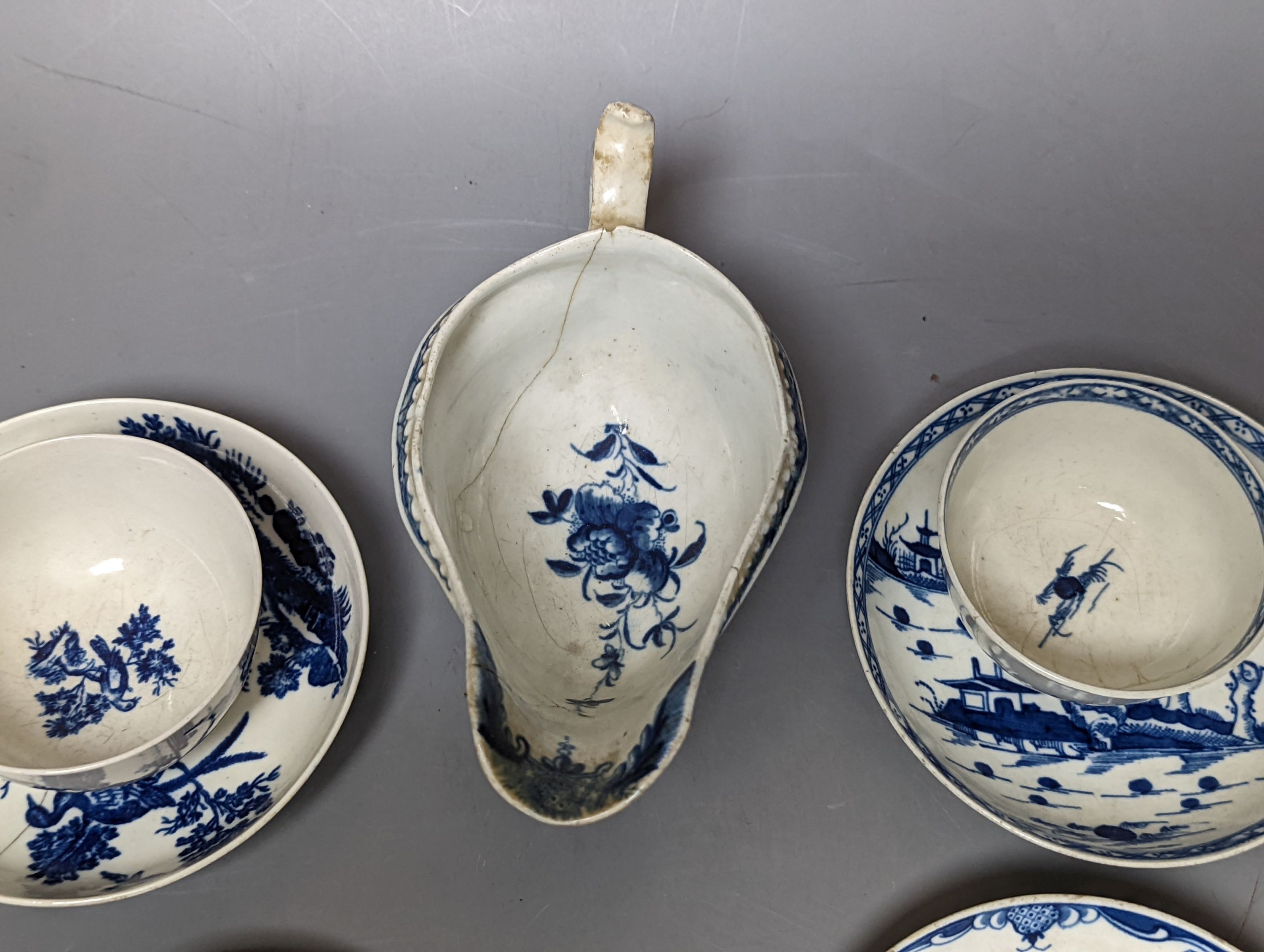 A Worcester blue and white sauceboat, two tea bowls and saucers, late 18th century and a Japanese single saucer. (7)
